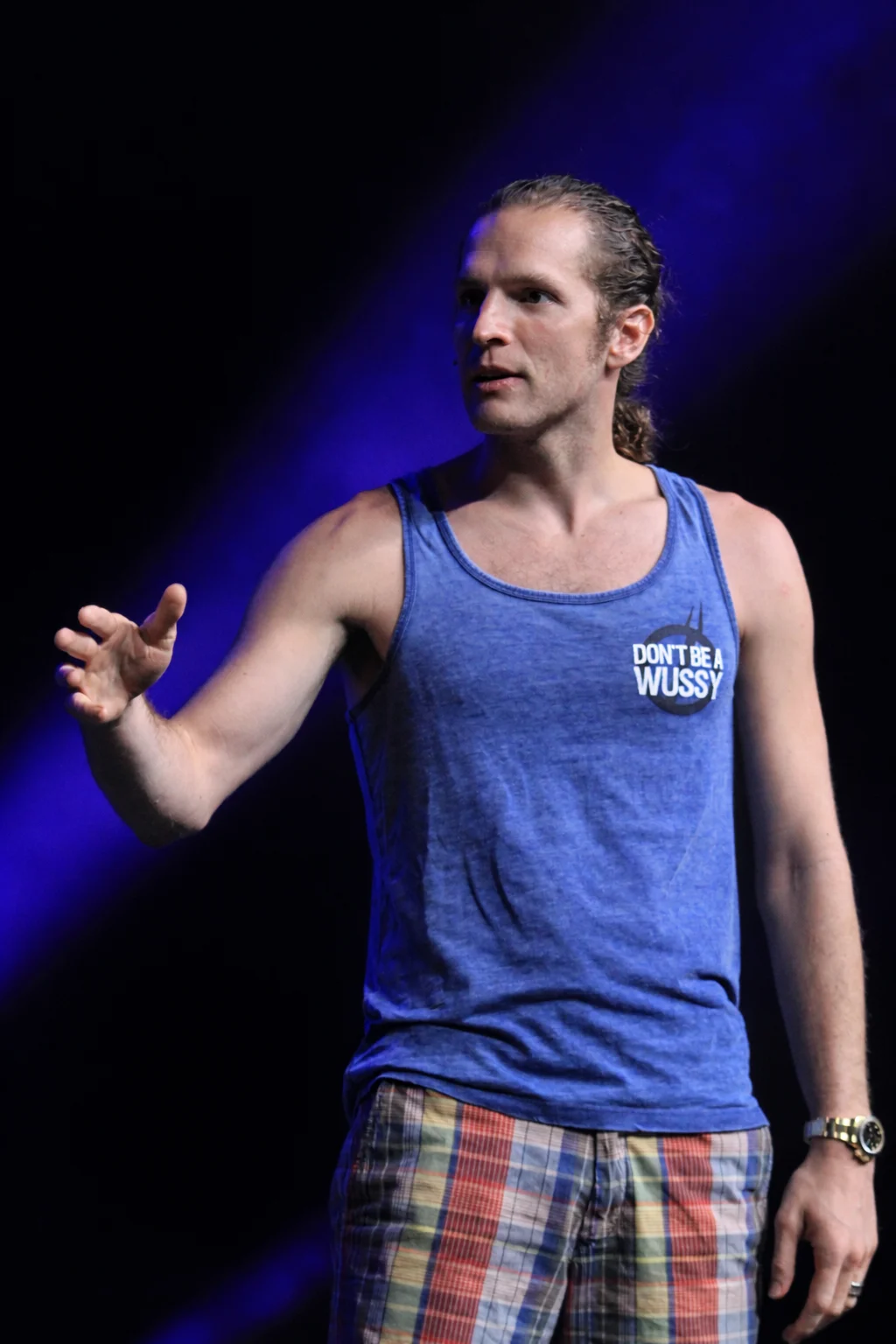 Dave Wood on stage, gesturing as he speaks